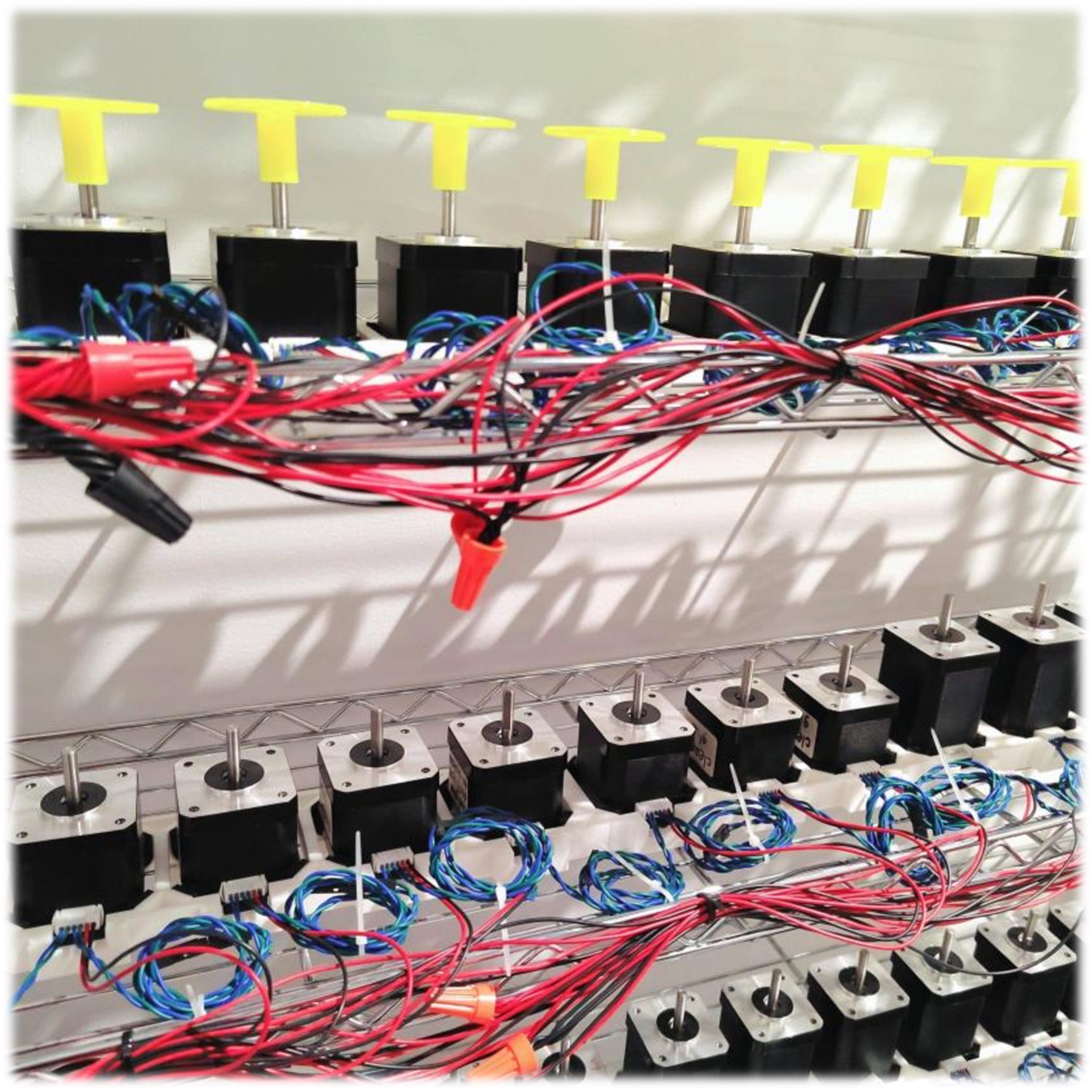 A rack of M17 motors in automated test equipment